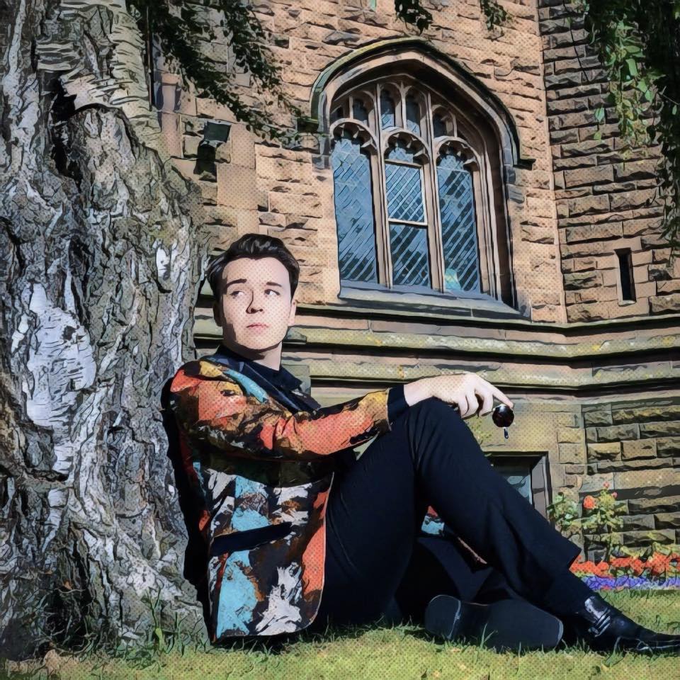 Nick Davies sitting on the spot where John Lennon met Paulk McCartney for the first time